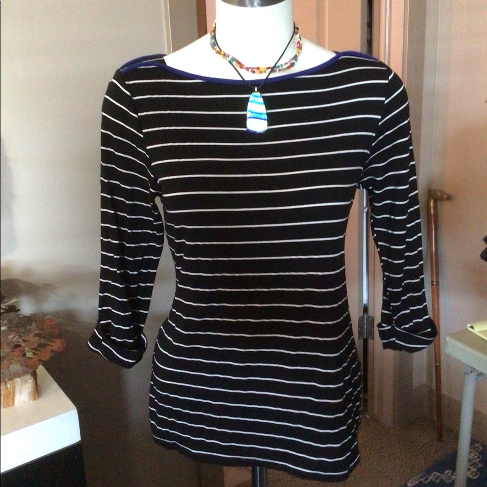 Black T-shirt with white stripes and blue corded detailing at neck line.